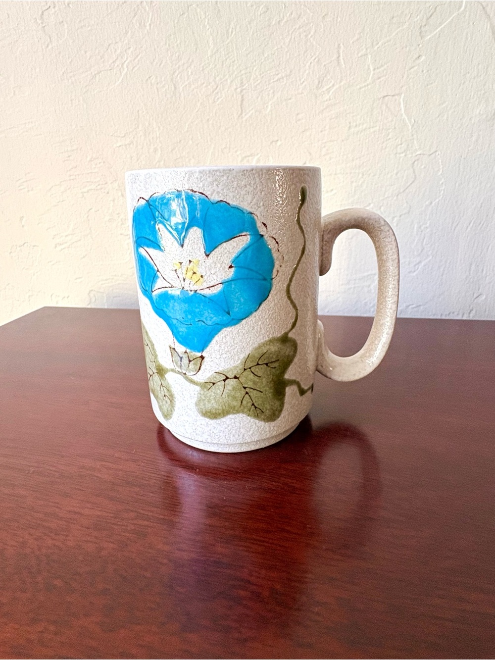 Vintage ceramic coffee mug with blue and white morning glory flower
